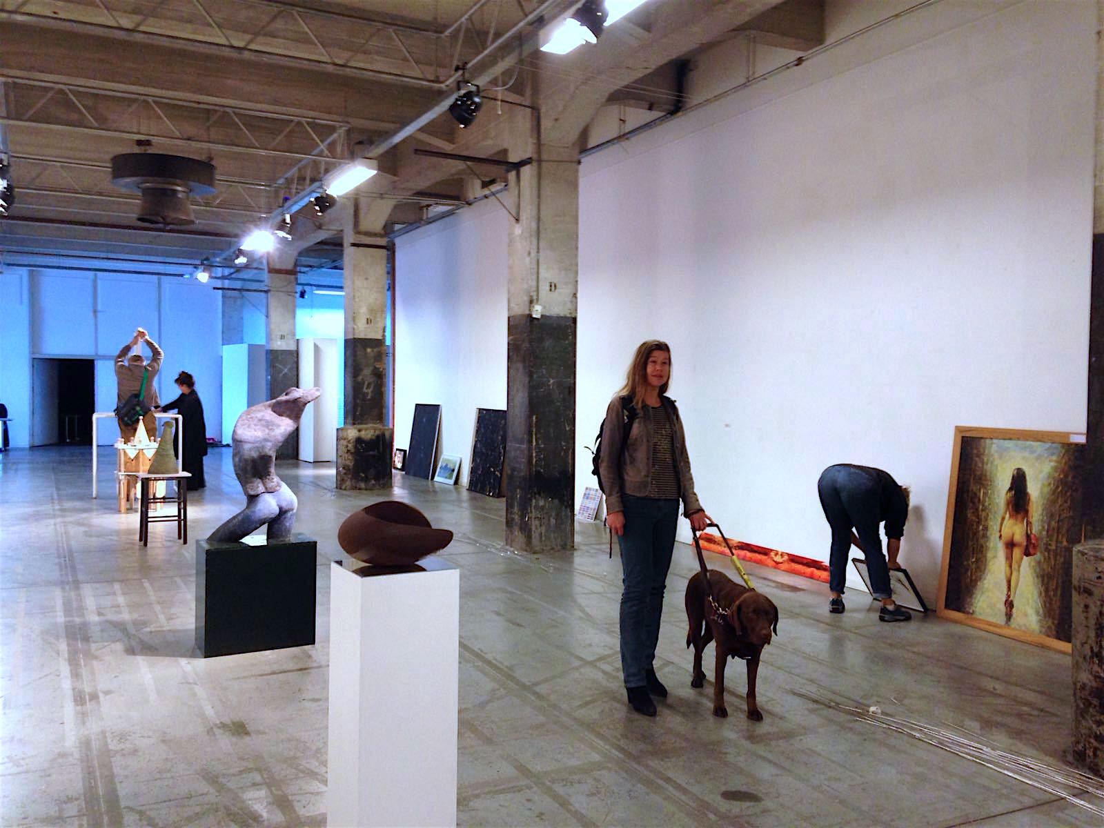 Photo shows Laura Meddens and her guide dog Nugget checking the preparations for the Open Ateliers Oost exhibition this Saturday and Sunday at the SBK Gallery in Amsterdam. Photo by Helen Pappa Hoitsma.