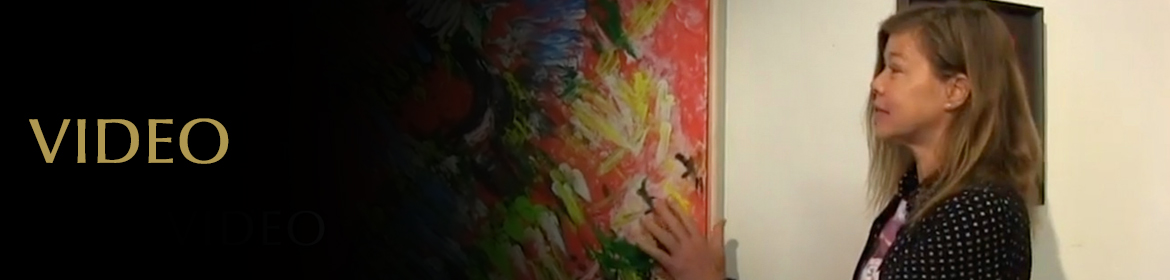 Video Page Banner: Video still of Laura Meddens feeling the texture of her painting "Tropical Splash" at her first public exhibition.